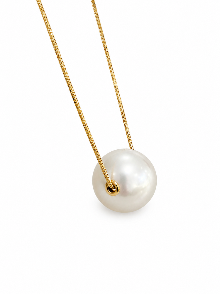 Pearl necklace with gold chain on a white background