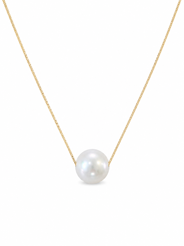 Pearl necklace on a gold chain against a white background