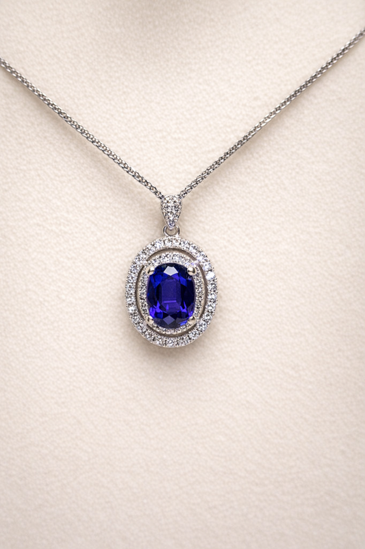 0.887ct blue sapphire and diamond halo pendant